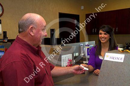 Man making a bank deposit in Boise, Idaho, USA. MR