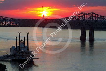 Sunset with steamboat under the Natchez-Vidalia Bridges spanning the Mississippi River between Vidalia, Louisiana and Natchez, Mississippi, USA.