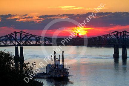 Sunset with steamboat under the Natchez-Vidalia Bridges spanning the Mississippi River between Vidalia, Louisiana and Natchez, Mississippi, USA.