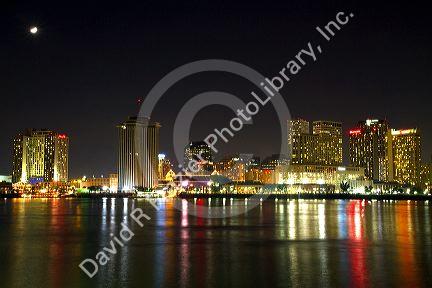 Night skyline of the city of New Orleans along the Mississippi River, Louisiana, USA.