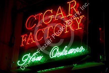 Cigar Factory neon sign in the French Quarter of New Orleans, Louisiana, USA.