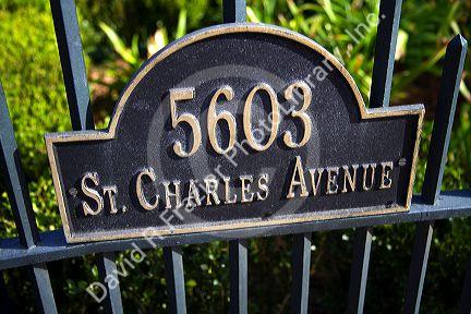 Address sign on the gate of the McCarthy House on Saint Charles Avenue in the Garden District of New Orleans, Louisiana, USA.