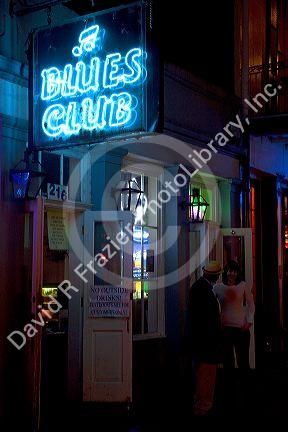 Blues Club neon sign on Bourbon Street in the French Quarter of New Orleans, Louisiana, USA.