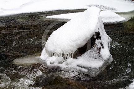 Snow and ice during winter at Grimes Creek, Boise County, Idaho, USA.