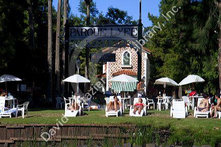 People sunbathe at a rowing club along the Parana Delta at Tigre, Argentina.