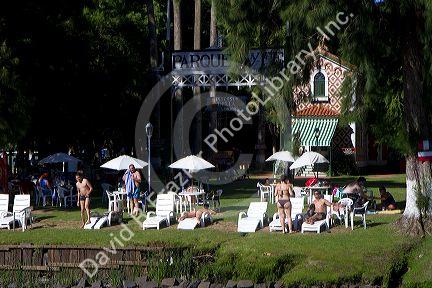 People sunbathe at a rowing club along the Parana Delta at Tigre, Argentina.