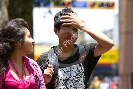 Peruvian teenagers in Central Park of the Miraflores district of Lima, Peru.