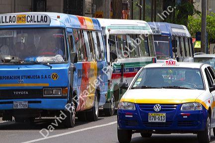 Public transportation buses and taxicab in Lima, Peru.