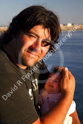 Argentine father with new born baby at Necochea, Argentina.