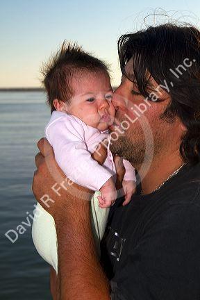 Argentine father with new born baby at Necochea, Argentina.