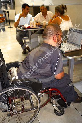 Quadriplegic Argentine man using a computer by typing with his mouth in Buenos Aires, Argentina.