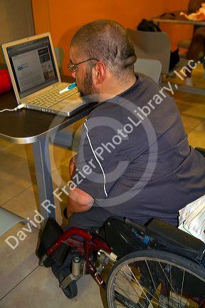 Quadriplegic Argentine man using a computer by typing with his mouth in Buenos Aires, Argentina.