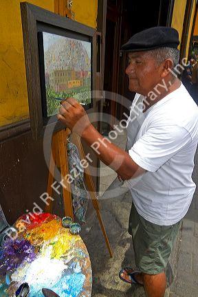 Artist painting in central Lima, Peru.
