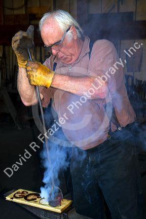 Blacksmith demonstration at Old Town San Diego State Historic Park, California, USA.