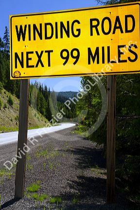 Road sign warning of winding road along US-12 in Northern Idaho, USA.