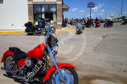 Motorcycles parked in front of a store during Sturgis Motorcycle Rally in Spearfish, South Dakota, USA.