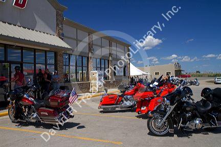 Motorcycles parked in front of a store during Sturgis Motorcycle Rally in Spearfish, South Dakota, USA.