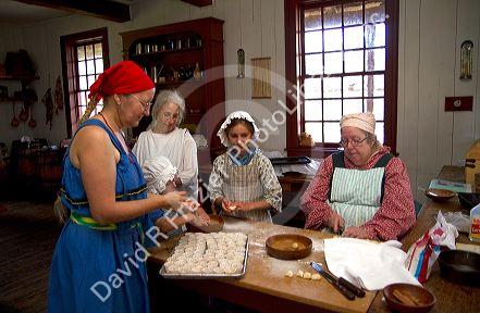 People participate in a rendezvous re-enactment at the Grand Portage National Monument on the north shore of Lake Superior in northeastern Minnesota, USA.