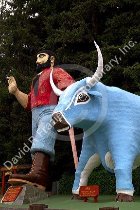 Paul Bunyan and Babe the Blue Ox statues at Trees of Mystery, a roadside attraction located in Klamath, California, USA.