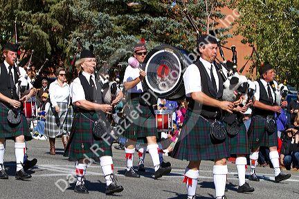 The Boise Highlanders playing bagpipes and drums in the Trailing of the Sheep Parade on Main Street in Ketchum, Idaho, USA.