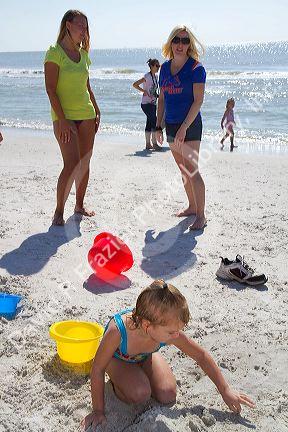 Women talking at Madeira Beach in Pinellas County, Florida, USA.