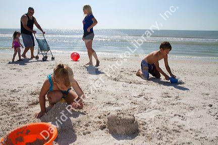 Brother and sister playing at Madeira Beach in Pinellas County, Florida, USA.