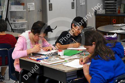 Students reading in a fourh grade classroom at a public elementary school in Brandon, Florida, USA.