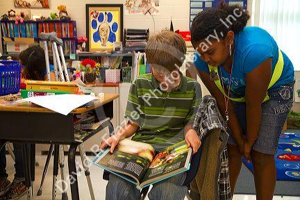 Students reading in a fourh grade classroom at a public elementary school in Brandon, Florida, USA.