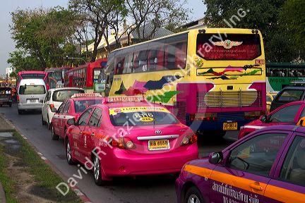 Bus and automobile traffic near the Grand Palace in Bangkok, Thailand.
