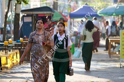 Hindu mother and daughter walk on the street in (Rangoon) Yangon, (Burma) Myanmar.