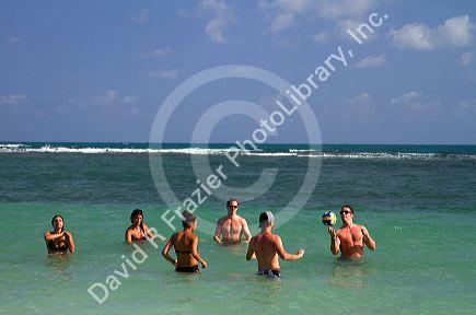People play volleyball in the Gulf of Thailand at Chaweng beach on the island of Ko Samui, Thailand.