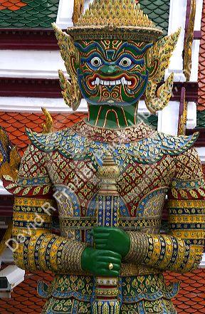 Buddhist mythology yaksa guarding the Temple of the Emerald Buddha located within the precincts of the Grand Palace, Bangkok, Thailand.