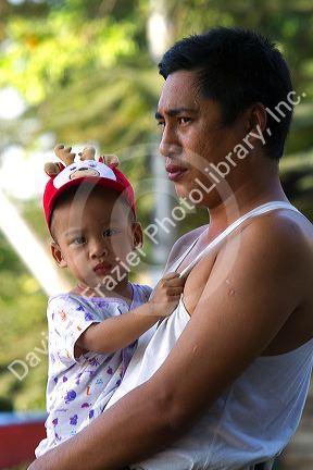 Burmese father and son in (Rangoon) Yangon, (Burma) Myanmar.