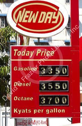 Automobile fuel prices in Kyat currency at a gas station in (Rangoon) Yangon, (Burma) Myanmar.