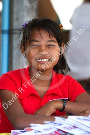 Burmese girl selling newspapers in (Rangoon) Yangon, (Burma) Myanmar.