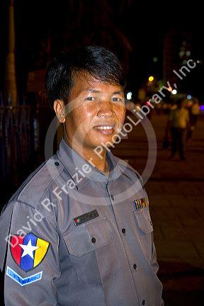 Burmese police officer in (Rangoon) Yangon, (Burma) Myanmar.