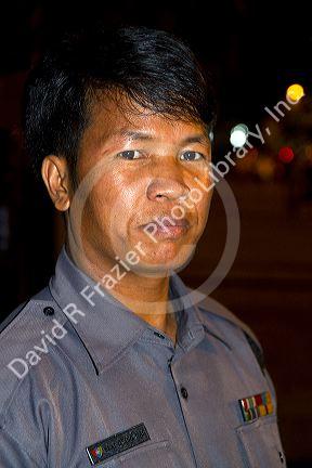 Burmese police officer in (Rangoon) Yangon, (Burma) Myanmar.