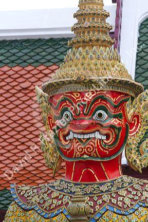 Buddhist mythology yaksa guarding the Temple of the Emerald Buddha located within the precincts of the Grand Palace, Bangkok, Thailand.