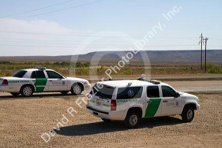 Border patrol vehicles parked at an inspection station along Interstate 10 east of El Paso, Texas, USA. 
