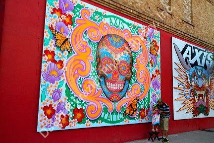 Mural on the side of a tattoo shop being used as a backdrop for a portait in Corpus Christi, Texas, USA.
