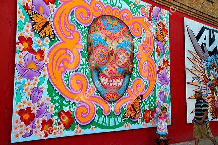 Mural on the side of a tattoo shop being used as a backdrop for a portait in Corpus Christi, Texas, USA.