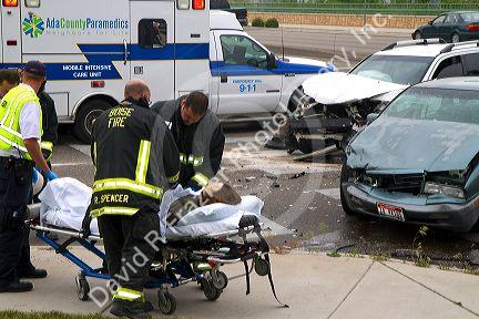 Paramedics and firefighters respond to an automobile injury accident in Boise, Idaho, USA.