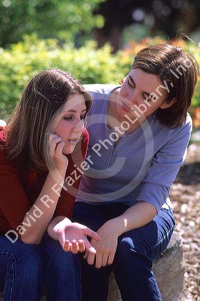 A teen comforting a depressed friend.  MR
