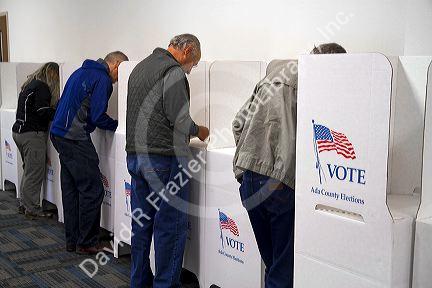 People vote in cardboard voting booths at a polling station in Boise, Idaho, USA.