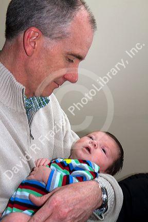 Father holding his infant son in Boise, Idaho, USA. MR