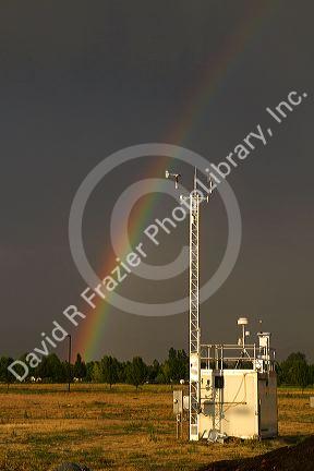 Rainbow over Ada County, Idaho, USA with remote weather monitoring station.