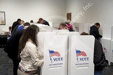 People vote in cardboard voting booths at a polling station in Boise, Idaho, USA.