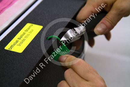 Keyless lock on a ballot box being cut off at a polling station in Boise, Idaho, USA.