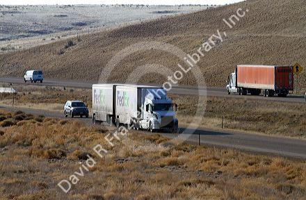Semi truck hauling a double trailer on Interstate 84 near Boise, Idaho, USA.