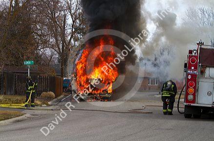 Firefighers putting out a motor home on fire in Boise, Idaho, USA.